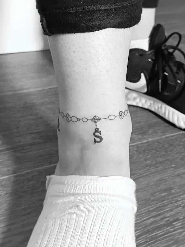 Initial anklet tattoo by @irisnawer_art