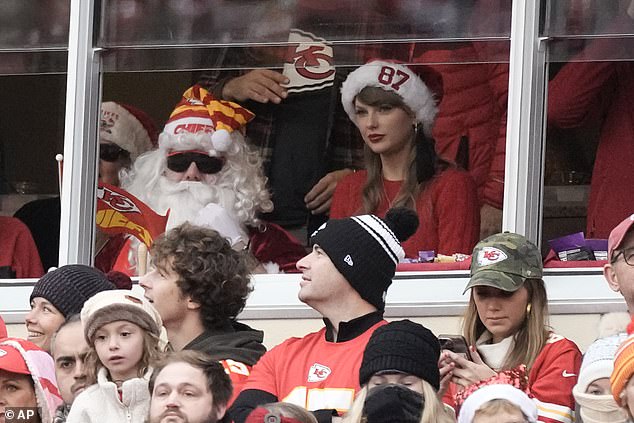 Taylor wore a Santa hat with Travis's jersey number stitched into the fur on Christmas