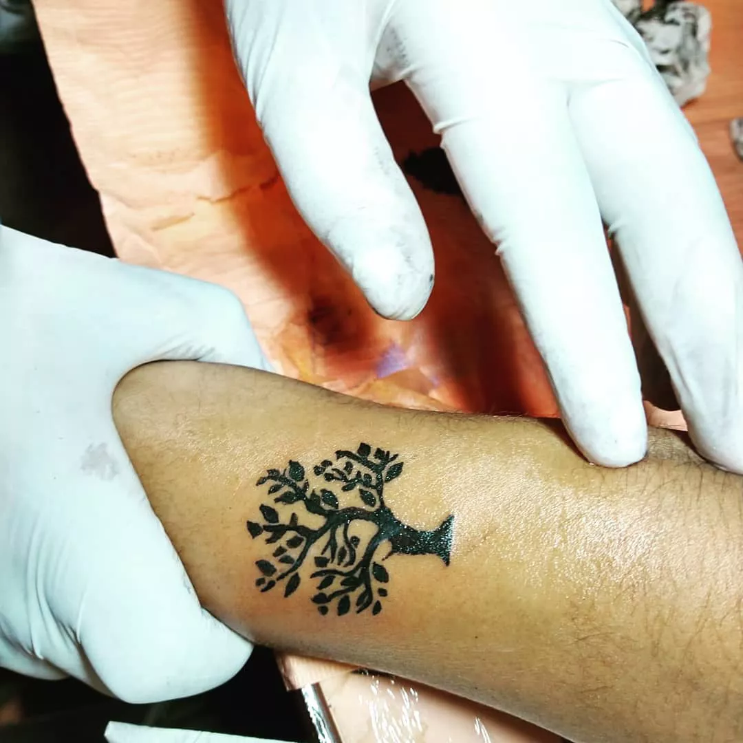 Close up of a blackwork tree tattoo