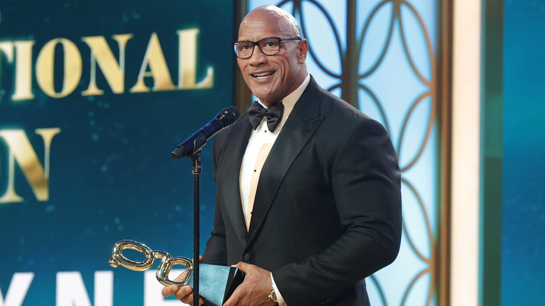 Dwayne Johnson accepts an award