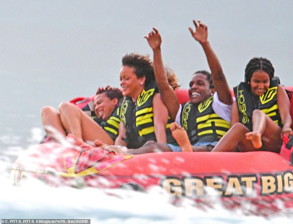 Sweet: The two even sat next to each other as they hopped on a four-person rider tube called the Sportsstuff Great Big Mable on the water