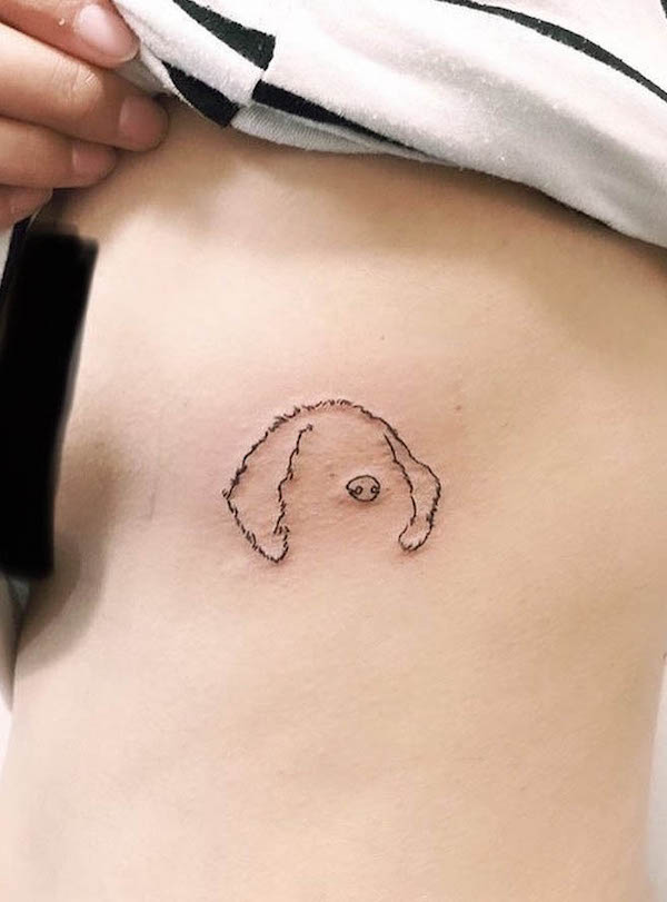 Simple dog ear outline rib tattoo by @kona.minicockapoo