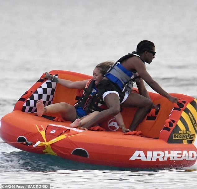 Rihanna has showed off the playful side to her romance with boyfriend A$AP Rocky as they enjoyed a hilarious boat ride while on holiday in Barbados on Tuesday