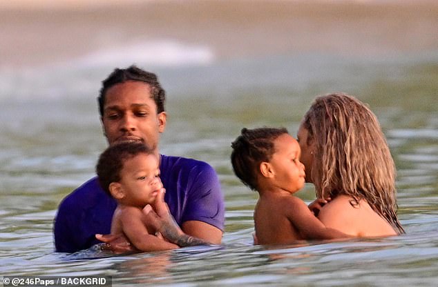 The family-of-four kept close while enjoying the water together