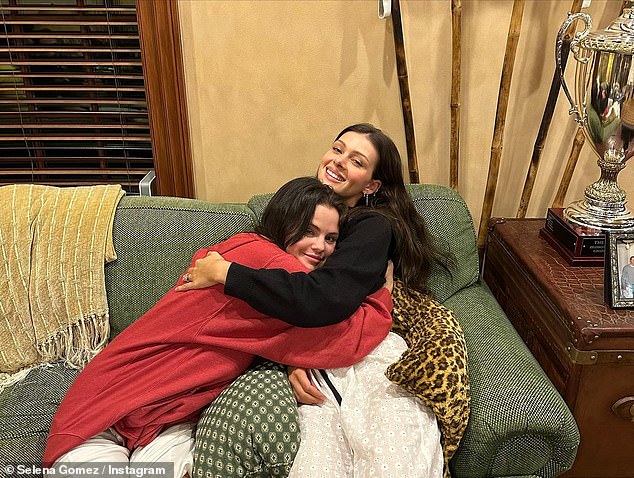 Indoor snuggles: One of the photos that Gomez shared on her Instagram page showed her (left) and Peltz (right) embracing each other while sitting on a green couch