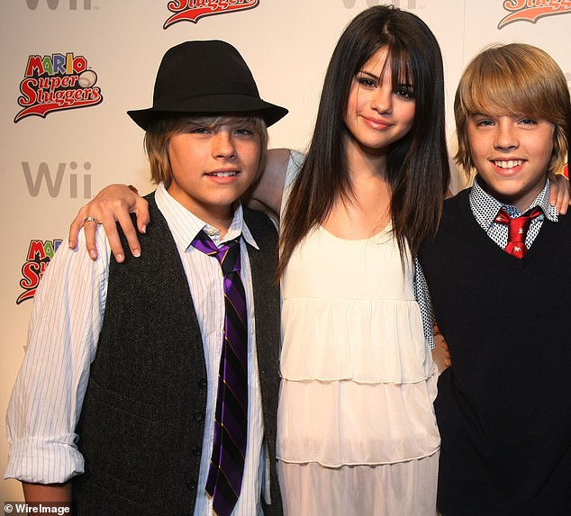 As they were: She poses with Dylan and Cole Sprouse at their 16th birthday party in 2008