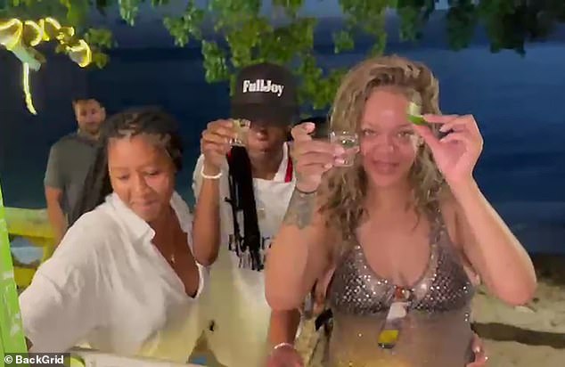 Rihanna, 36, appeared to be in a festive mood when she appeared at a beachfront bar where she and a trio of friends did some shots of tequila with lime