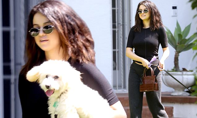 Selena Gomez keeps it casual in black top and trousers as she walks her  precious pup Winnie in LA | Daily Mail Online