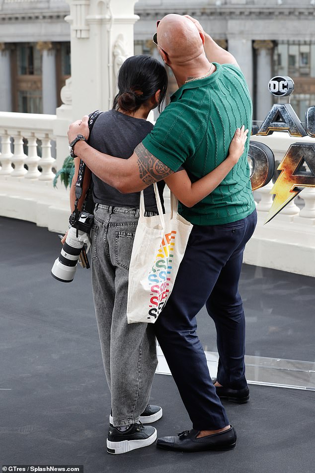 Dwayne 'The Rock' Johnson shows off bulging biceps in green shirt at Black  Adam photocall in Madrid | Daily Mail Online