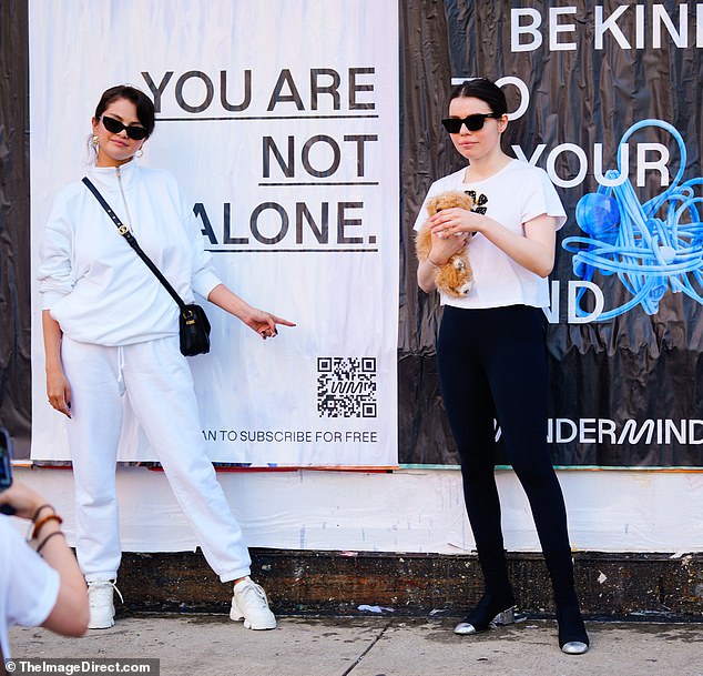 Hanging with a friend: Gomez was joined at lunch by fellow Disney Channel alum Sofia Carson who wore a white shirt, black leggings and black and silver high heels