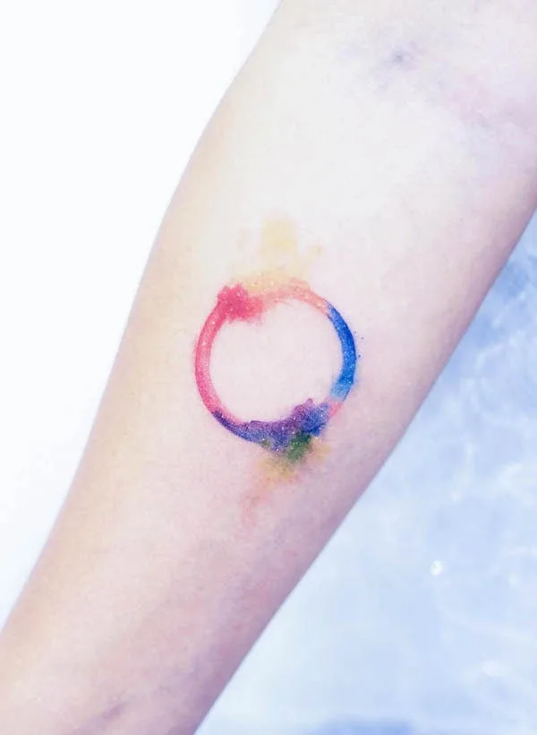 Watercolor circle tattoo by @minitattoo.ren