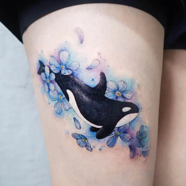 Killer whale watercolor thigh tattoo by @siren_ink