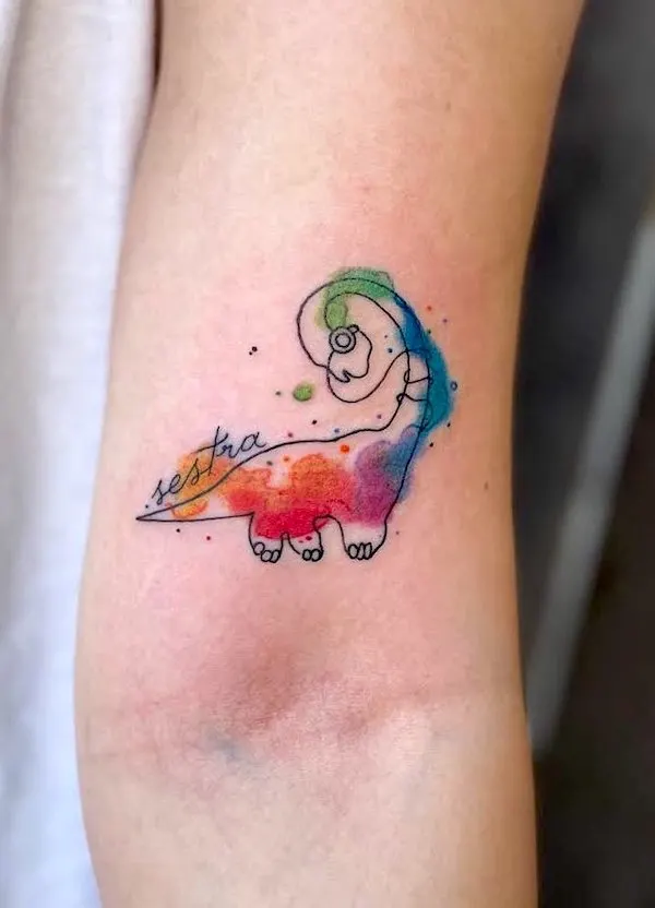 Watercolor small dinosaur tattoo by @livingartgallery