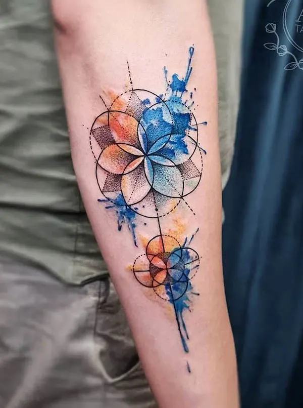 Two-color geometric arm tattoo by @ada.tattoos