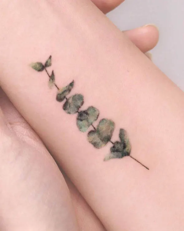 Watercolor leaves tattoo by @tattooist_hei