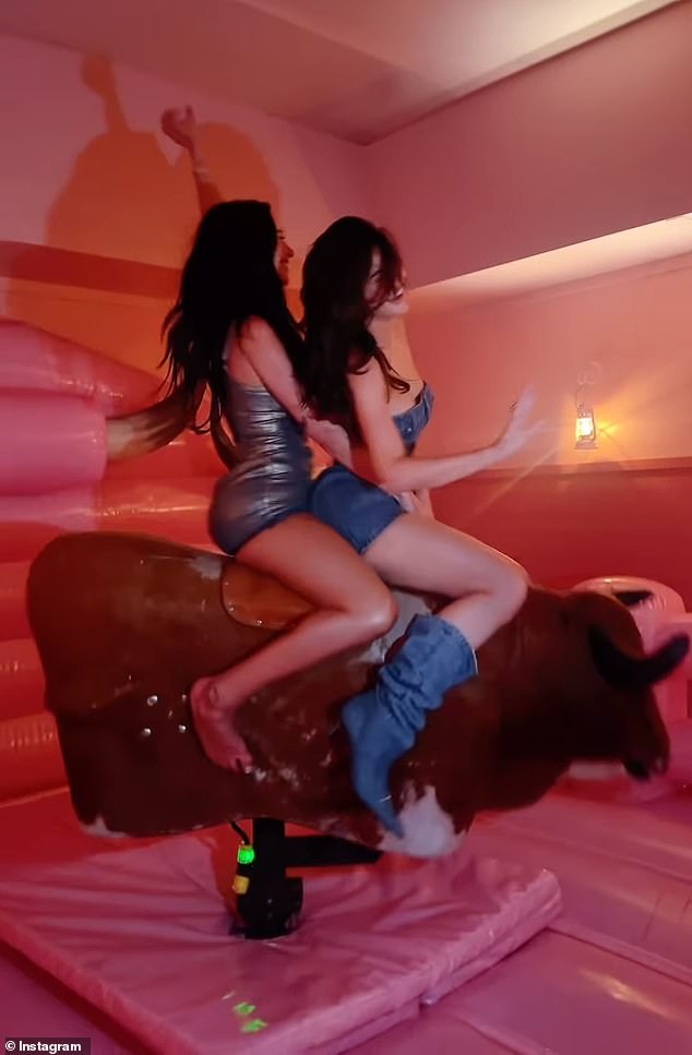 The beauty mogul, 26, took to Instagram to share hilarious footage of herself riding a mechanical bull with her BFF Stassie Karanikolaou at the big Dolly Parton-themed bash