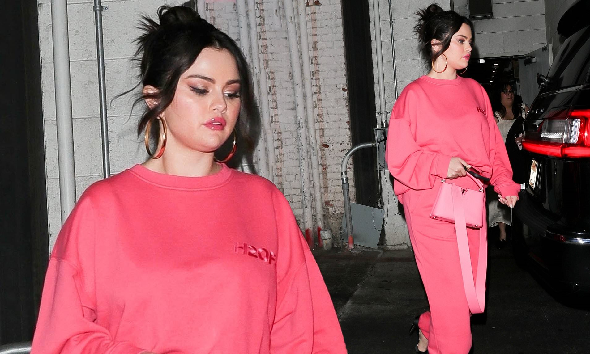 Selena Gomez turns heads in a bubblegum pink tracksuit | Daily Mail Online