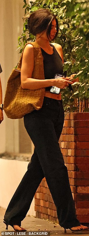 The mother-of-two carried a large, tan-colored intrecciato Bottega Veneta bag over her shoulder