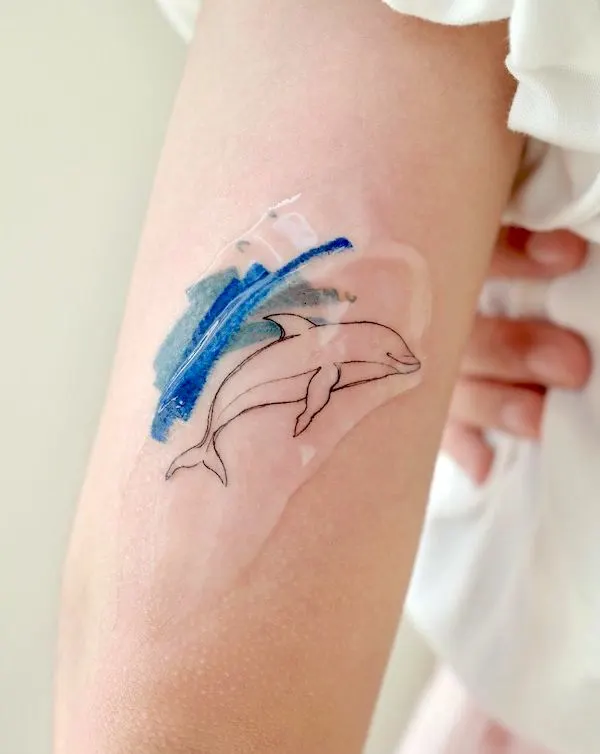 Minimalist dolphin tattoo by @tattoo_joojoo