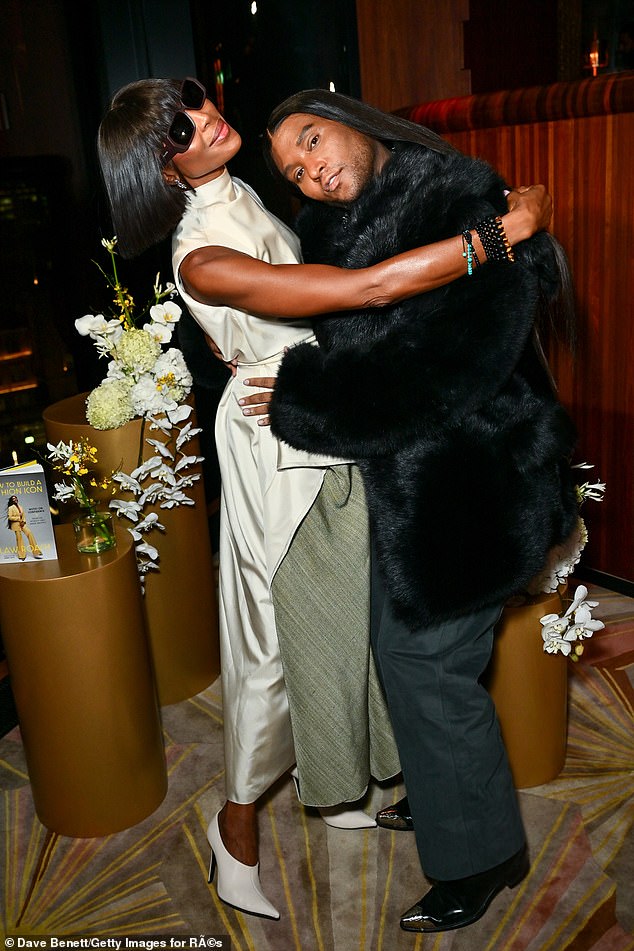 Naomi Campbell cut a stylish figure in a long white satin blouse as she supported pal Law Roach at his book launch in London on Monday night