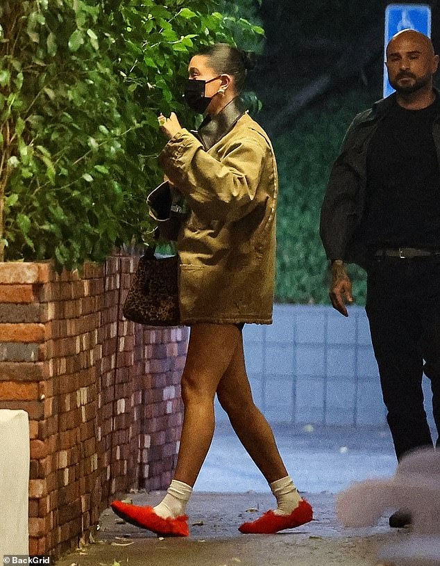 Hailey teamed her casual look with white socks and furry red flats