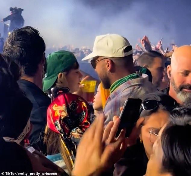 At Coachella, Taylor opted for a beer, as she and Travis took in the music