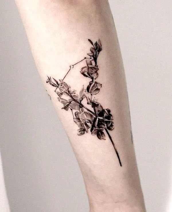 Realism flower tattoo in the shape of Aries constellation