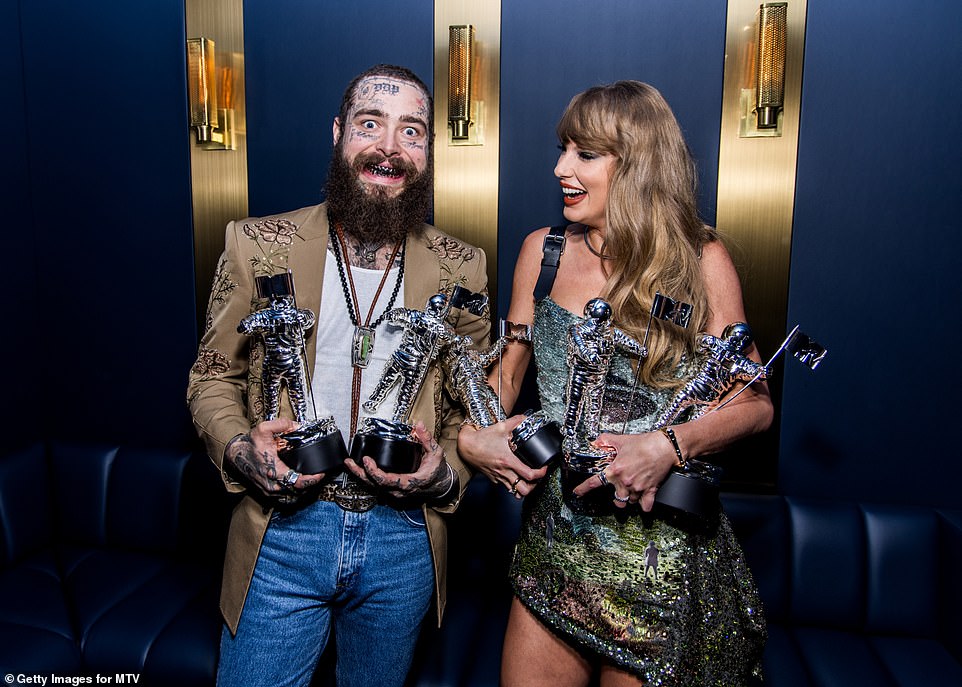 Swift and Post Malone - who took home the first televised award of the VMAs for best collaboration - posed with their trophies