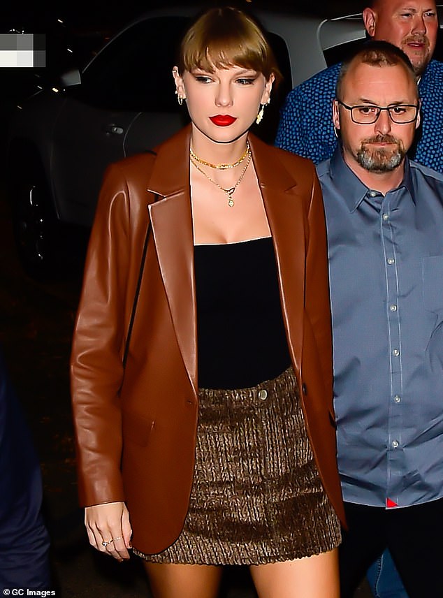 Looking fab: Taylor Swift was spotted radiating New York glamour when she surfaced in Midtown Manhattan this Friday night, at the close of a chockablock week