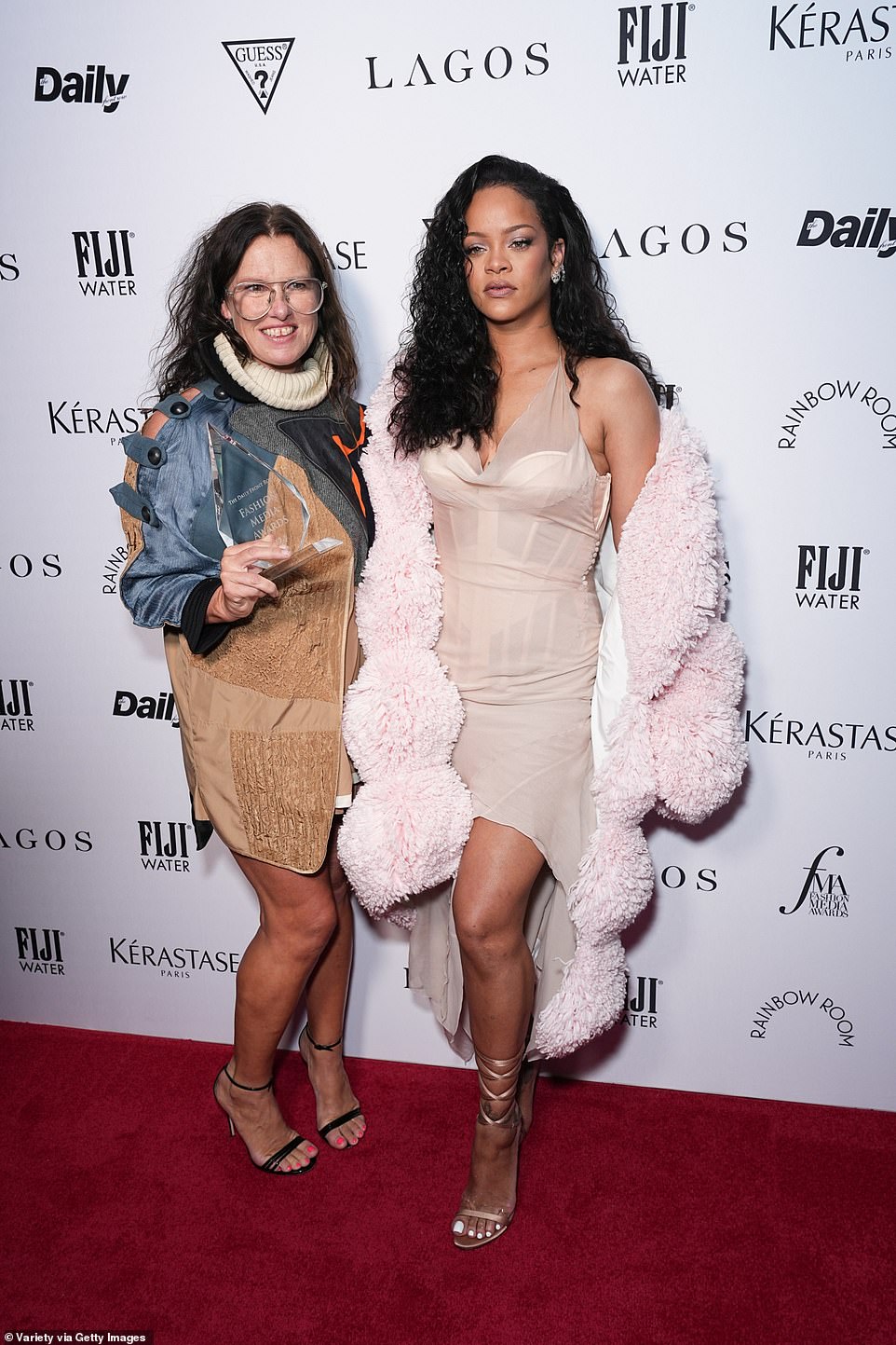 The Rude Boy hitmaker sizzled in a daring bustier-style sheer halter neck dress at the event, held at The Rainbow Room atop 30 Rockefeller Plaza; pictured with Katie Grand